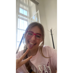 a girl with glasses making a funny face